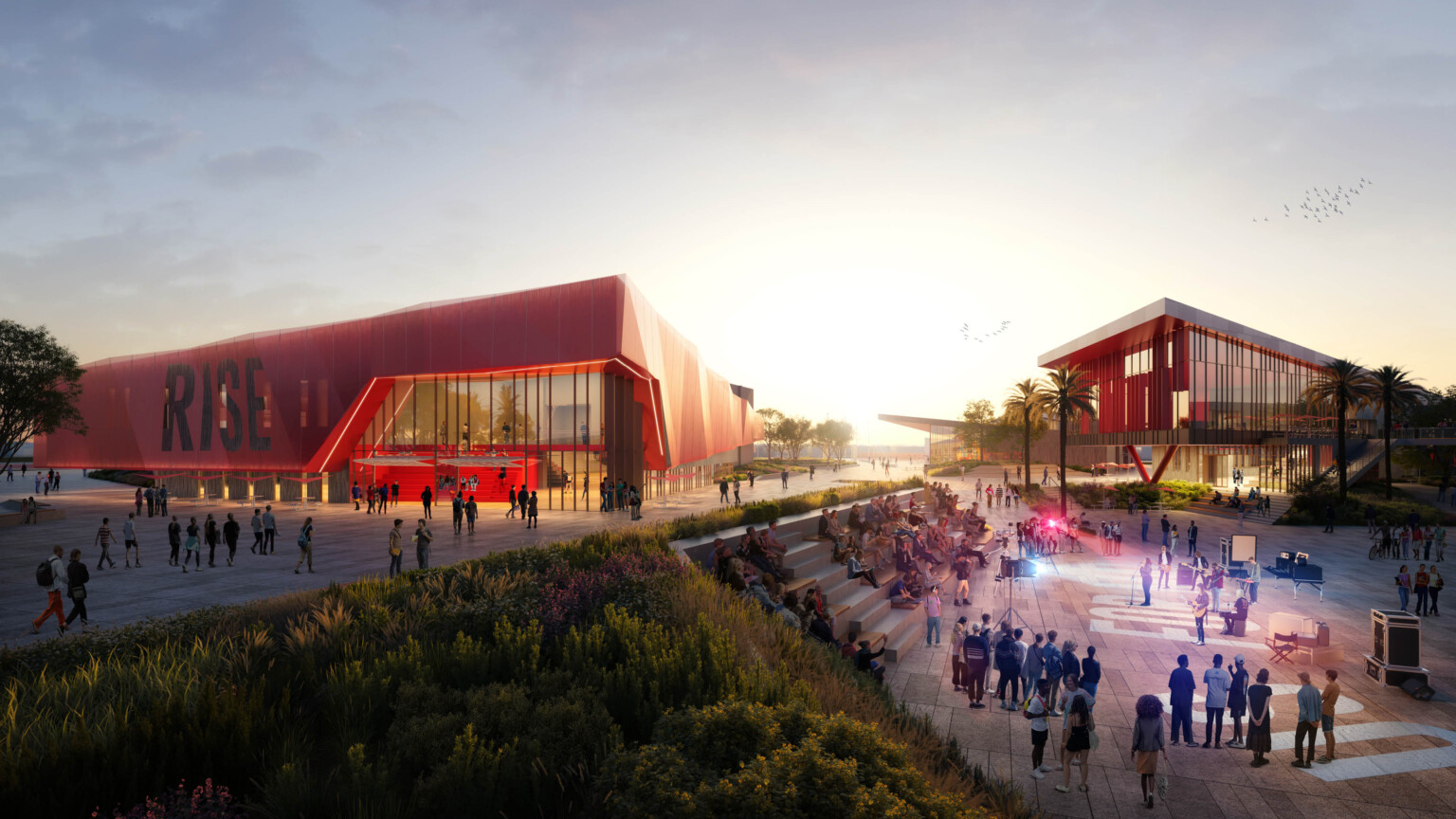 design concept for new high school in Compton showing steps leading up to multi-building campus; red metal façade and large windows create school identity