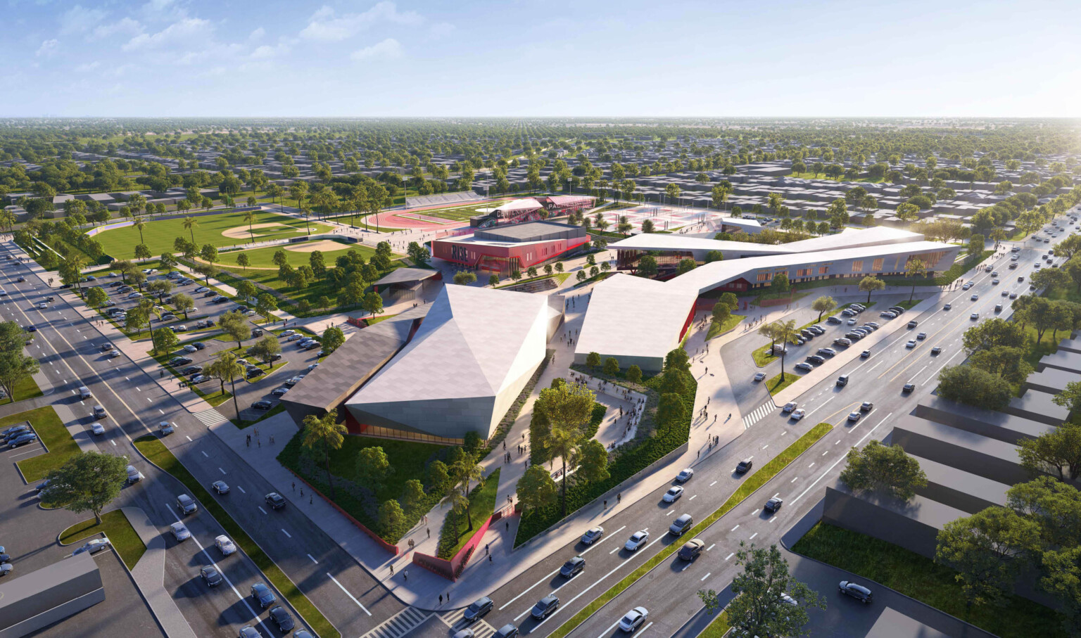 aerial view of Centennial High School in Compton, multiple buildings make up the campus with angular metal roofs and greenery throughout aerial view of Centennial High School in Compton, multiple buildings make up the campus with angular metal roofs and greenery throughout
