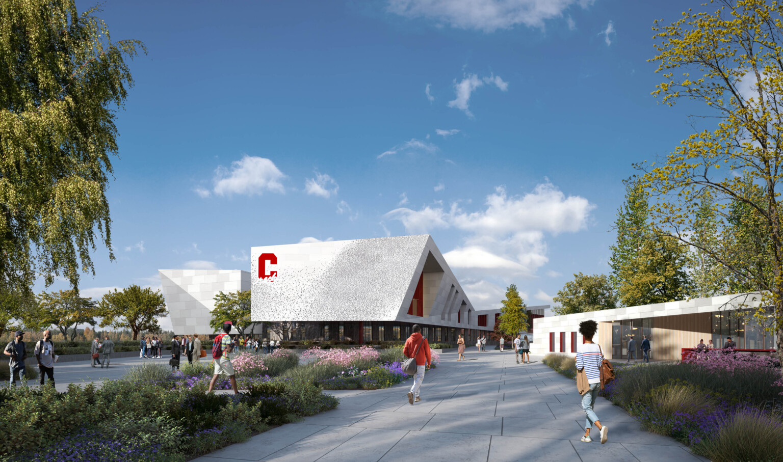 School branding on façade of new Centennial High School in Compton; perforated metal façade covers the angular buildings on campus creating shading for students