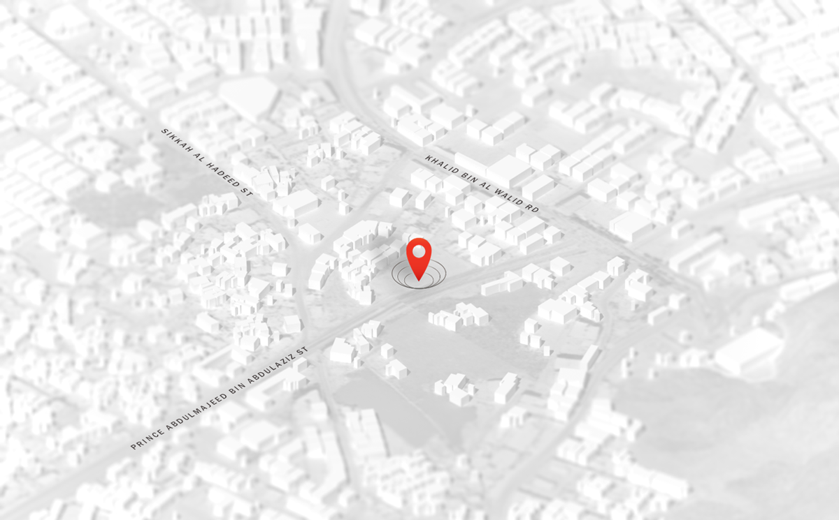 white and gray colored rendering of a city with a red location pinpoint in the middle white and gray colored rendering of a city with a red location pinpoint in the middle