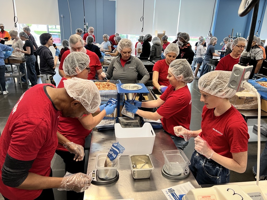 DLR Group employees packing produce