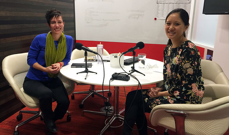 two women sitting at a table recording a podcast on women in design two women sitting at a table recording a podcast on women in design