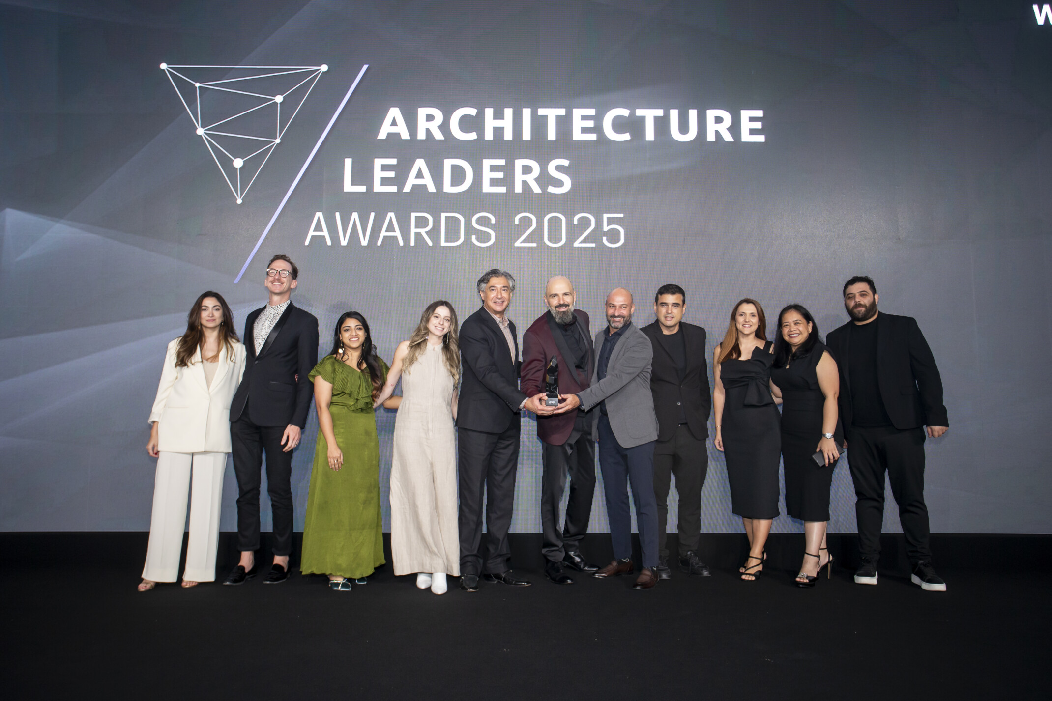 DLR Group Dubai studio receiving the award for Master Plan of the Year.