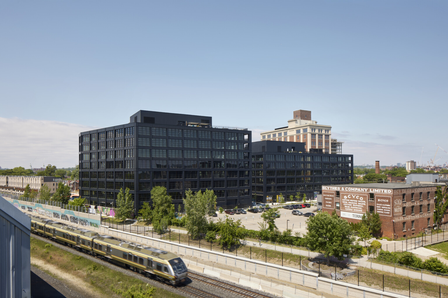 Black steel exterior midrise mass timber building Black steel exterior midrise mass timber building