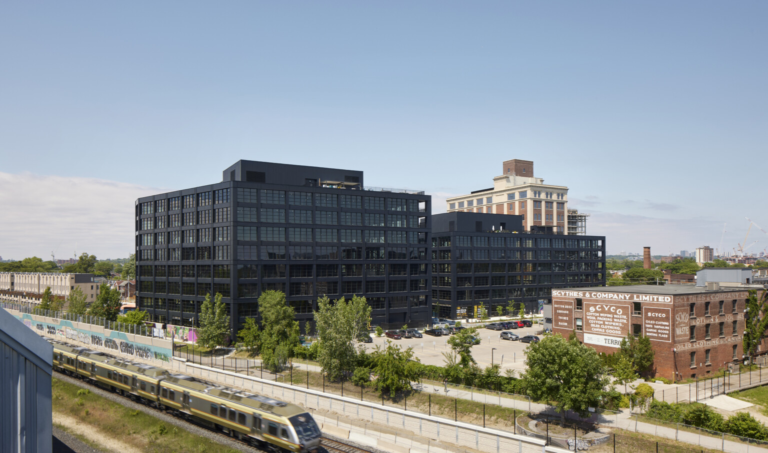 Black steel exterior midrise mass timber building Black steel exterior midrise mass timber building