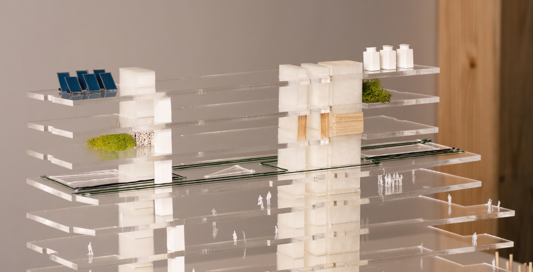 architectural model with clear acrylic floorplates, solar panels, greenery and wood details, and 3D printed cores