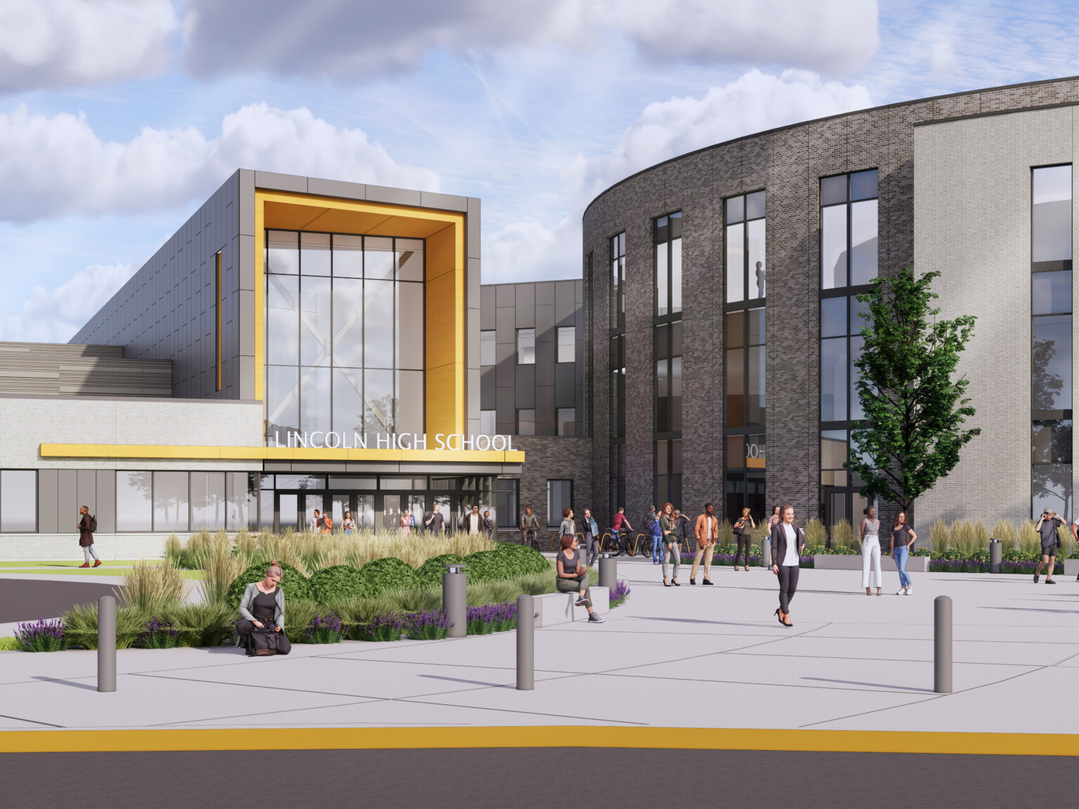 Front entrance to Lincoln High School. Landscaped sidewalk to 3 story building with covered entrance, round building to right