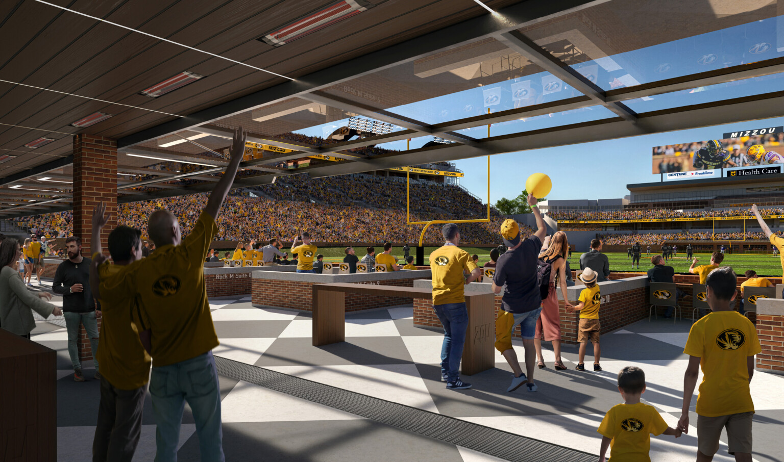 Seating and community space behind goal post of renovated football stadium fans engage with game Seating and community space behind goal post of renovated football stadium fans engage with game