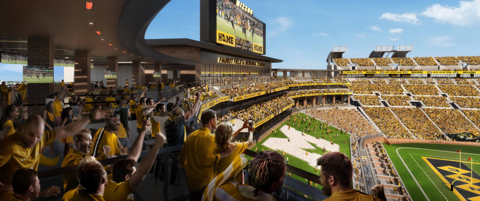 View from upper level stadium seats across North End of renovated Mizzou Memorial Stadium, large screen over grass seating with M Mizzou logo