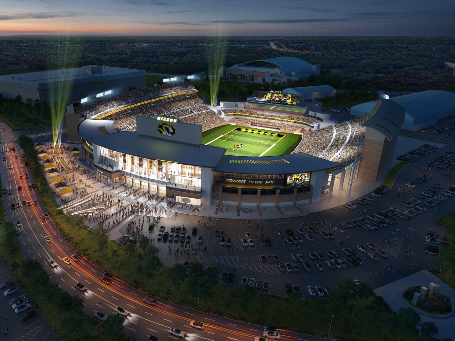 Aerial view Mizzou Tigers renovated open air stadium illuminated at night during football game