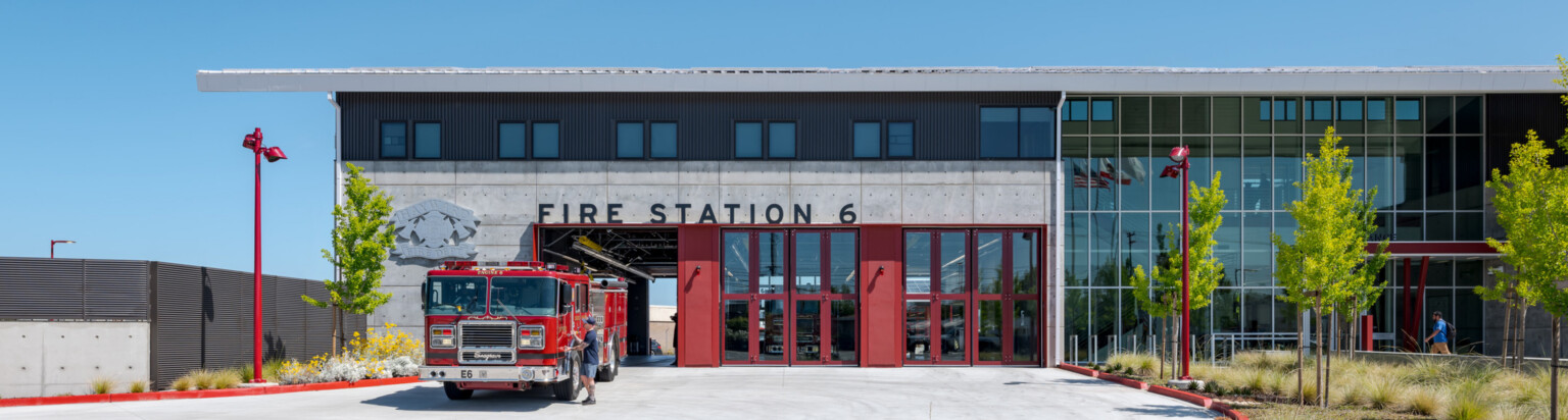 Front entrance to a fire station; modern sleek design with floor to ceiling windows