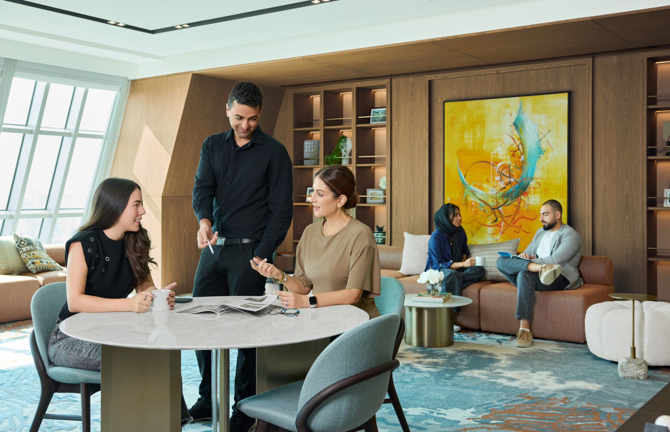 DLR Group employees collaborating in a community space in DLR Group's dubai office