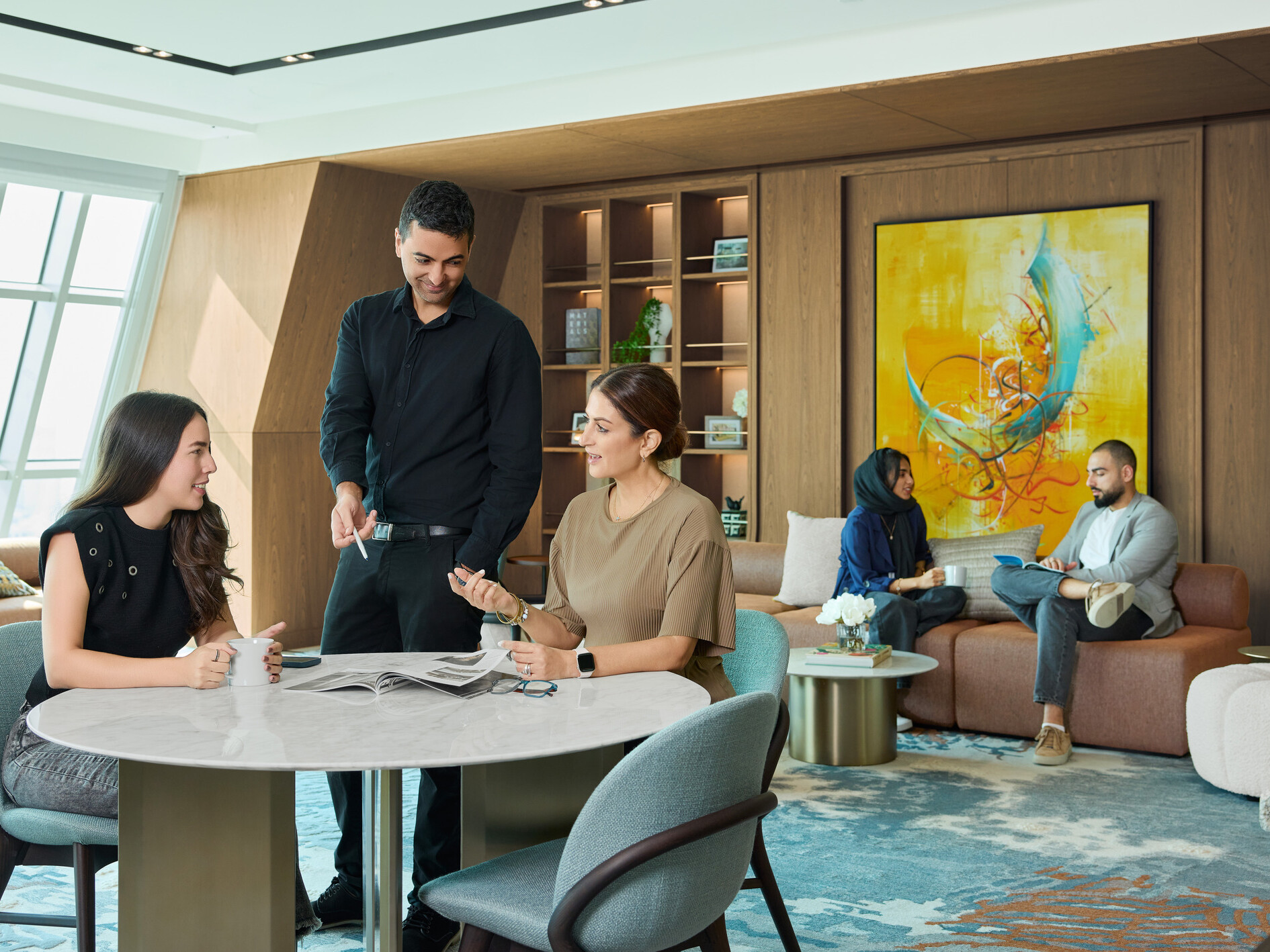 DLR Group employees collaborating in a community space in DLR Group's dubai office