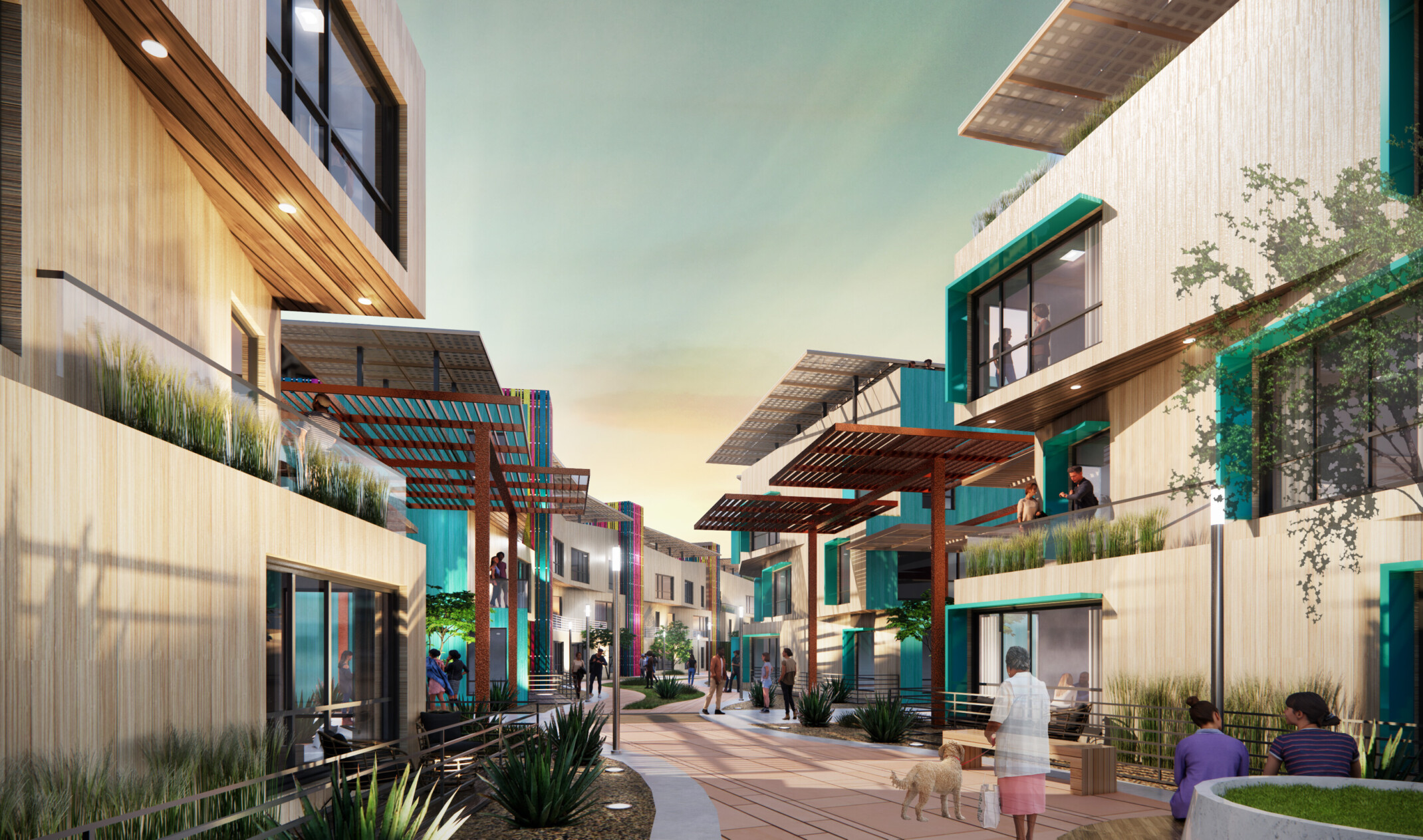 Lines of 3 story buildings face each other across central walkway, framed by covered patios, balconies, and greenery