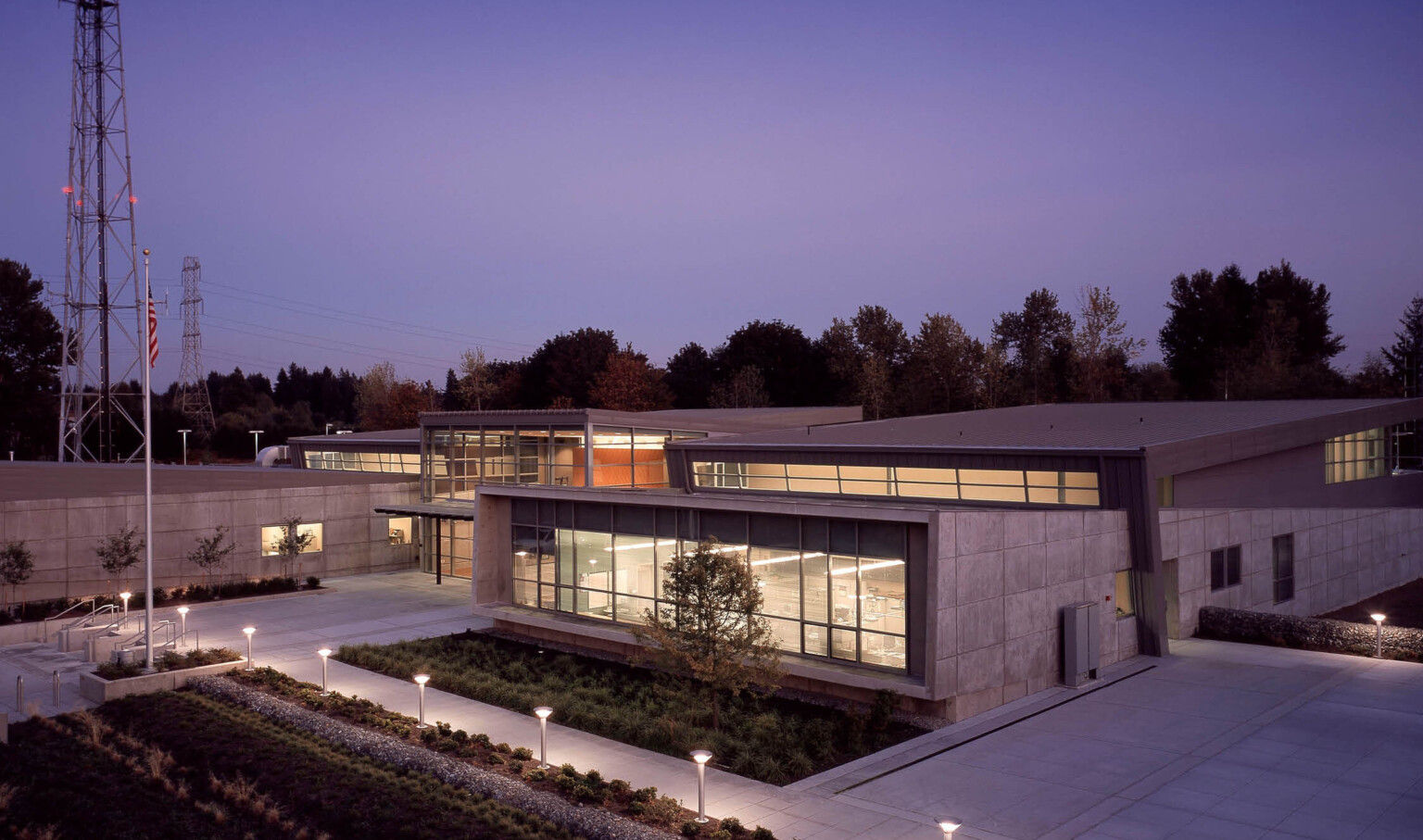 evening view of a communications and emergency center in Washington. Brutalism concrete façade is juxtaposed with modern glass walls. evening view of a communications and emergency center in Washington. Brutalism concrete façade is juxtaposed with modern glass walls.