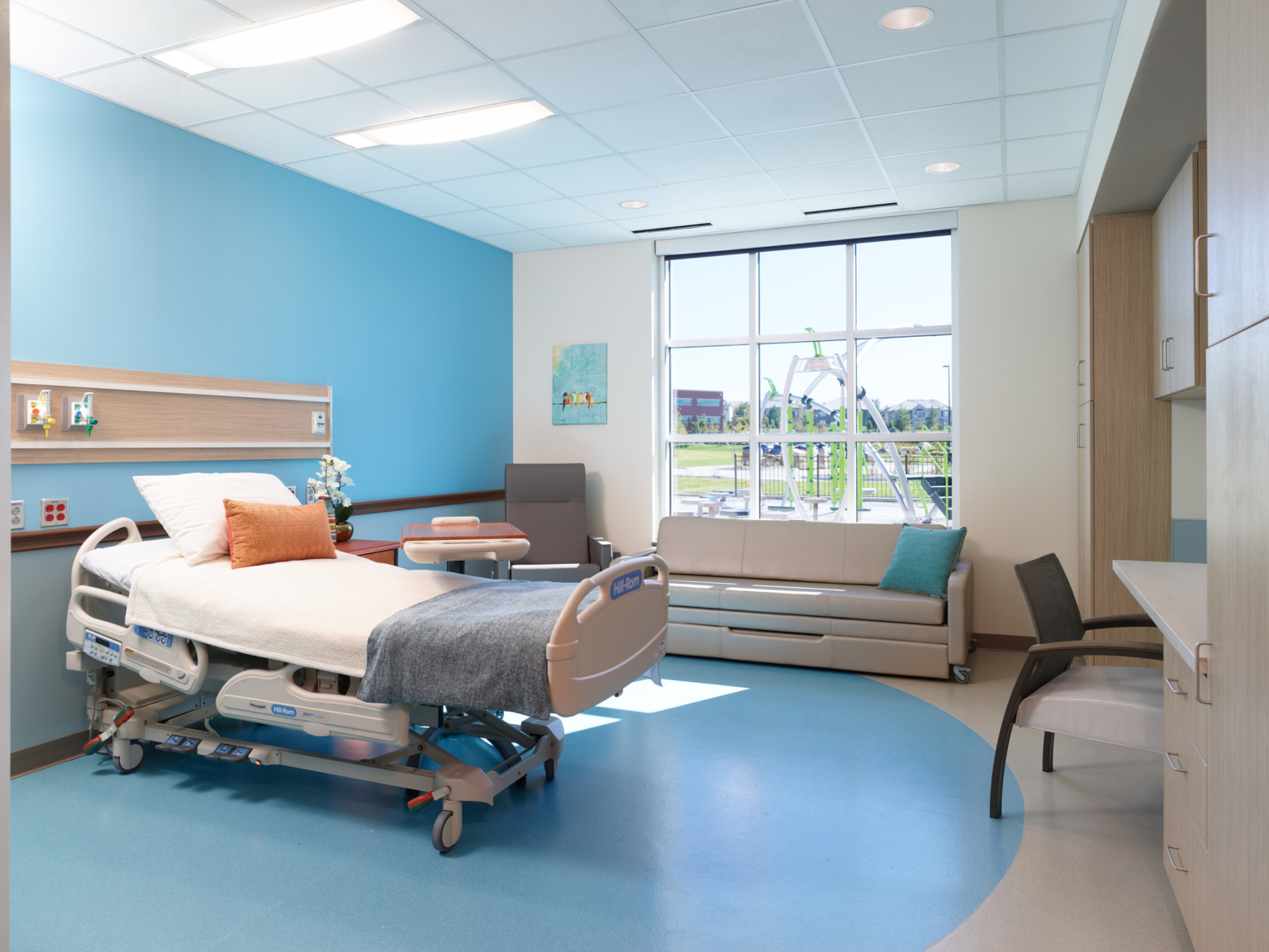 blue patient room at Madonna Rehabilitation Hospital
