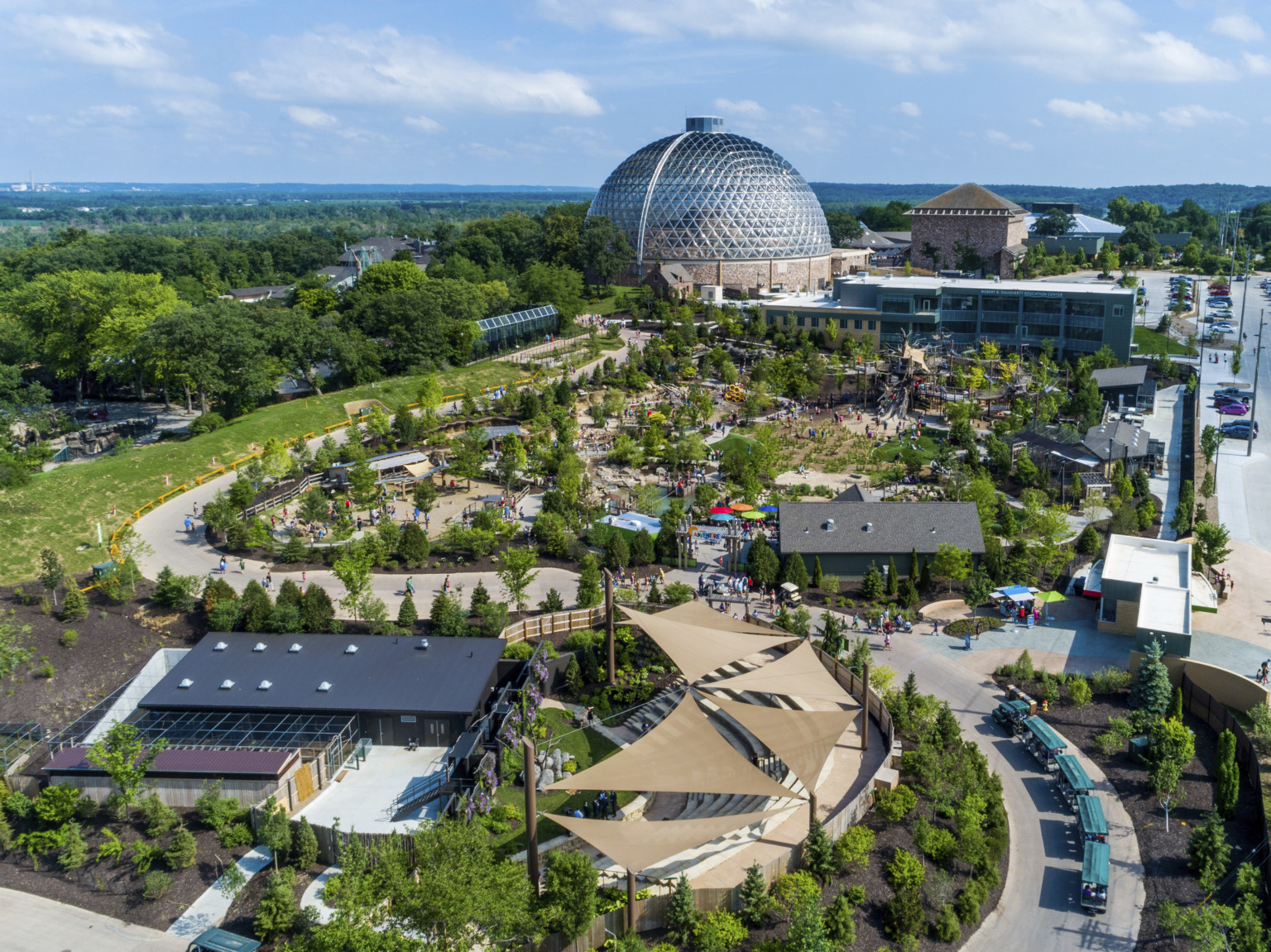 Aerial view of the Omaha Zoo, with a large glass domed building at center back Aerial view of the Omaha Zoo, with a large glass domed building at center back