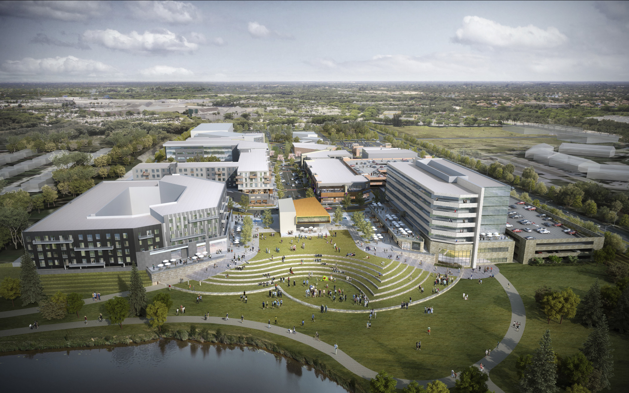 La Vista City Centre campus. Buildings line road and grassy central plaza with curving stepped landscape leading to water La Vista City Centre campus. Buildings line road and grassy central plaza with curving stepped landscape leading to water