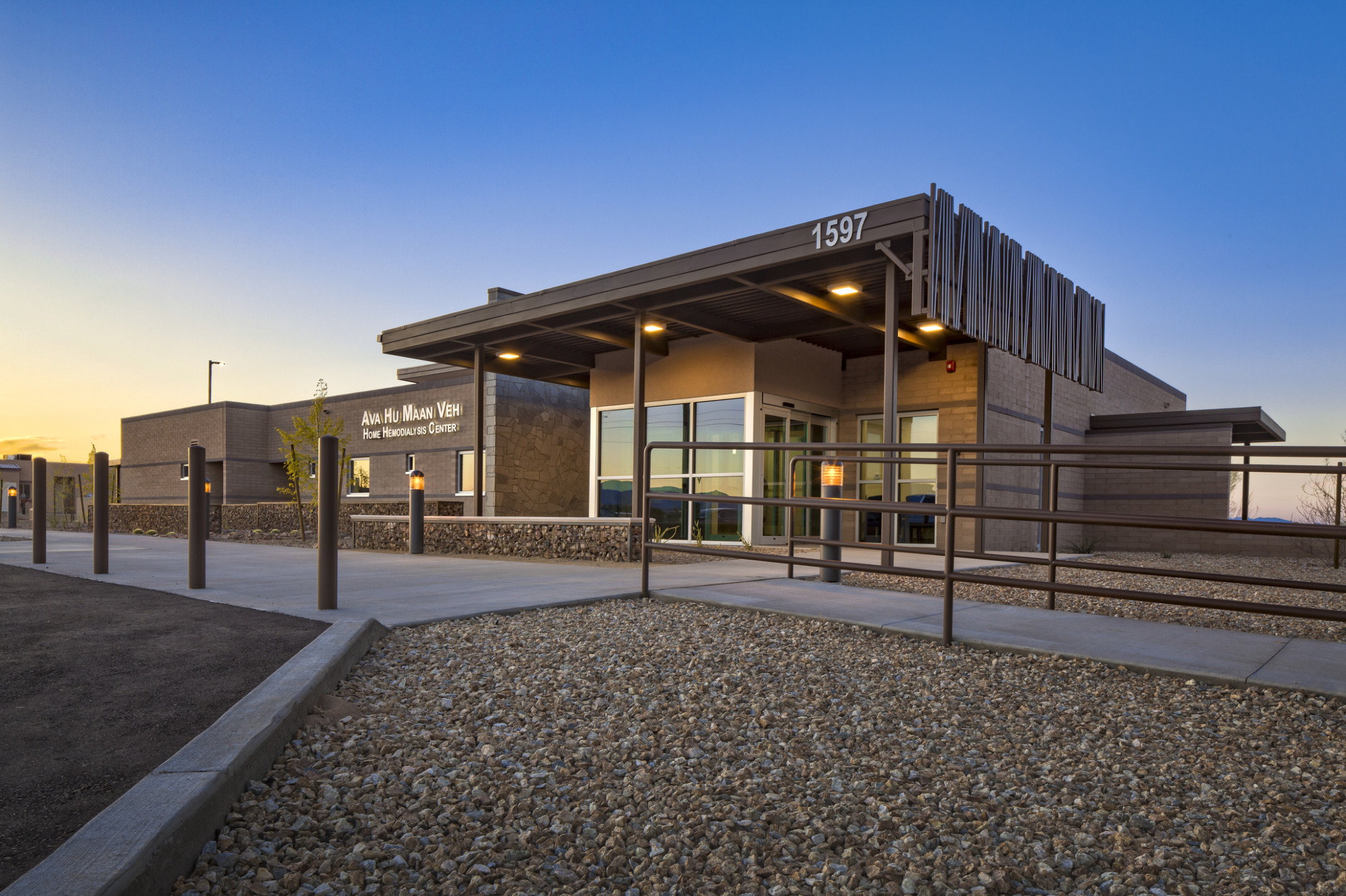Exterior of Ft. Mojave Indian Tribe Dialysis Home Therapy Clinic illuminated at dusk