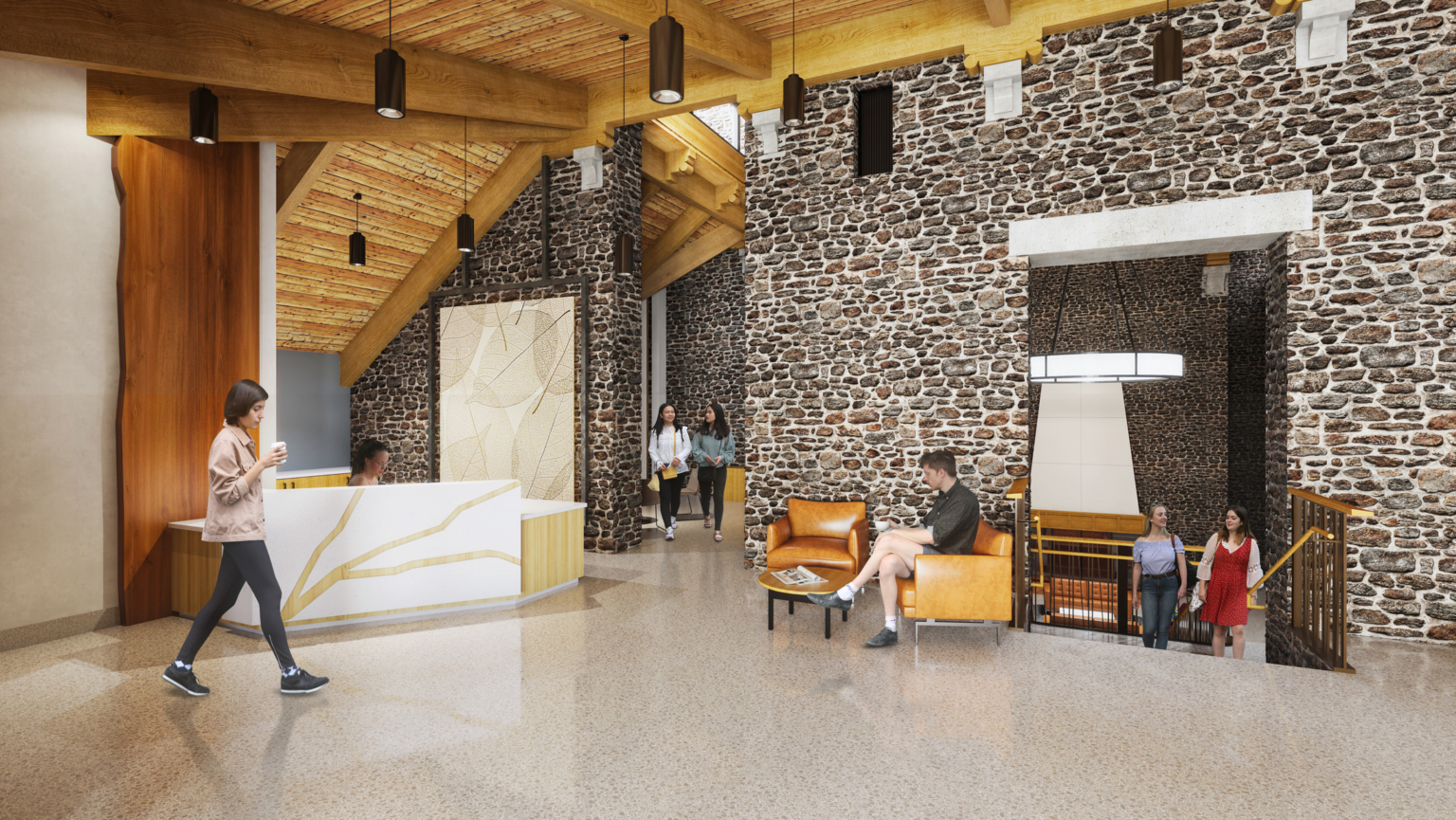 Front desk with stone accent wall, wood beams, and drop lighting at Swarthmore College Dining and Community Commons.
