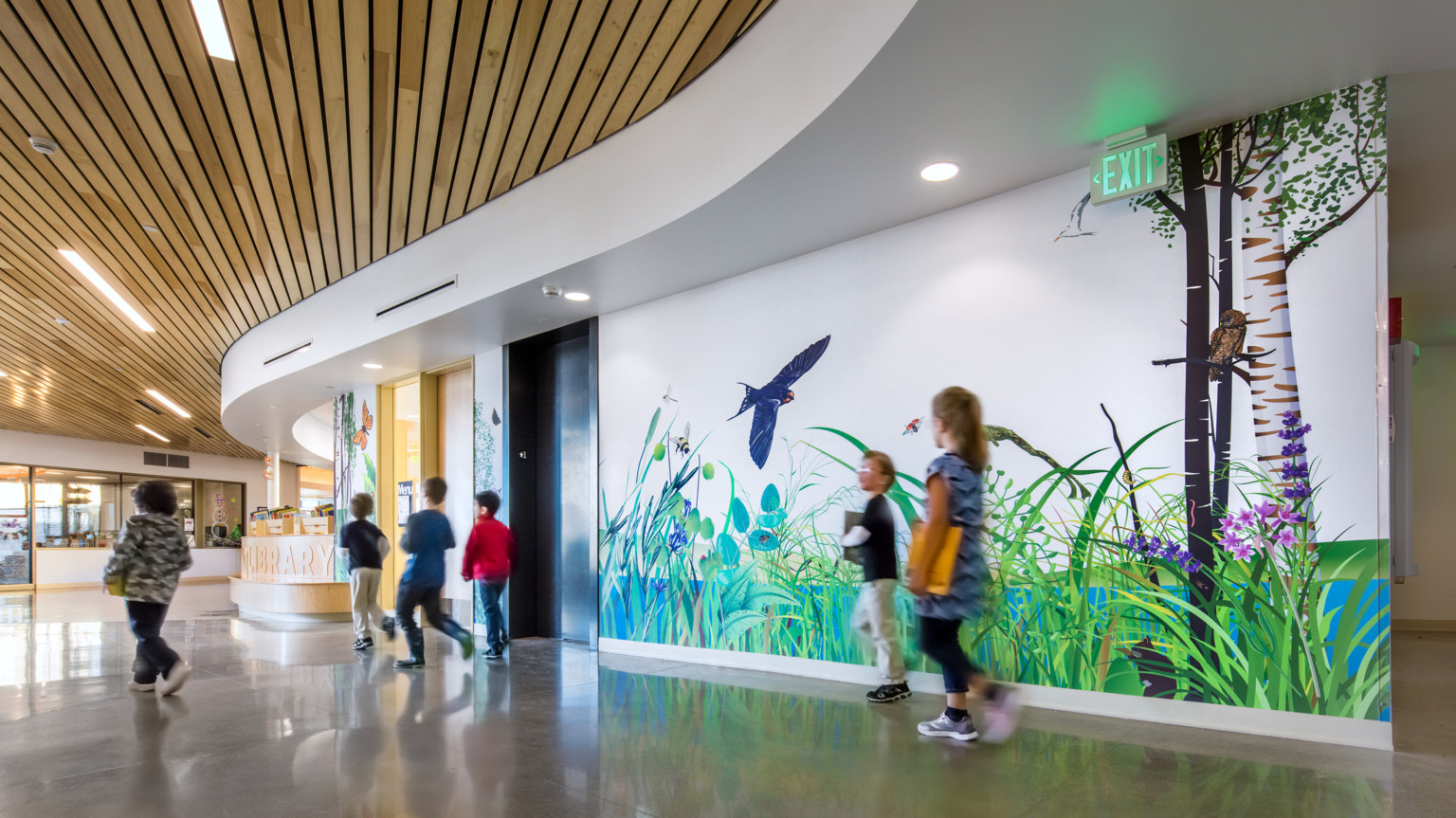 hallway with nature mural in a kindergarten center