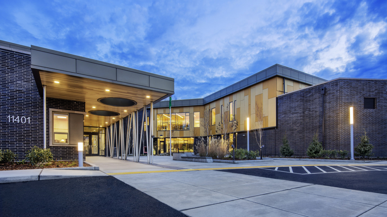 front entry sequence of Pathfinder Kindergarten Center illuminated at night
