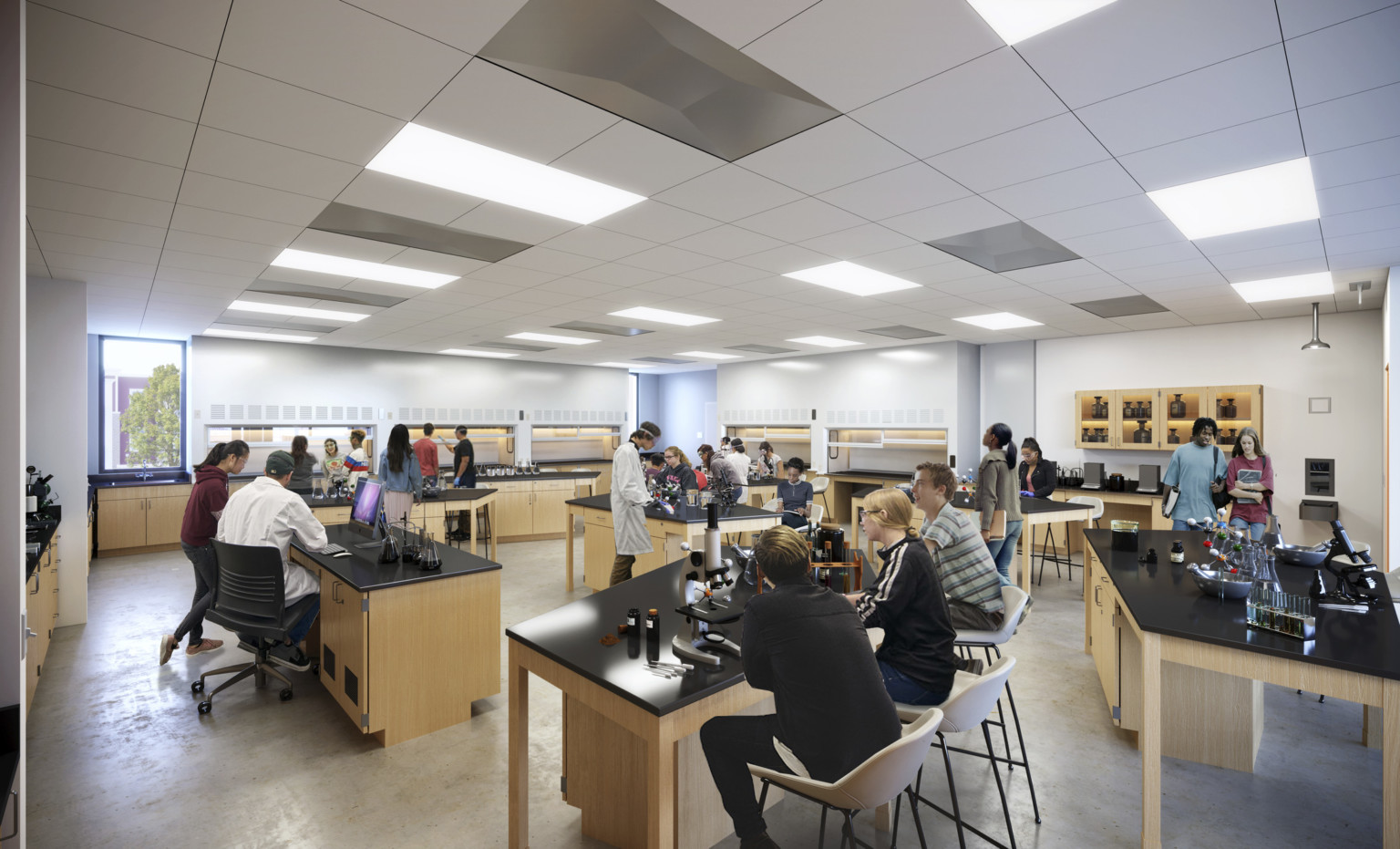 Interior view of science classroom with lab tables and seating, counter space and storage line the walls