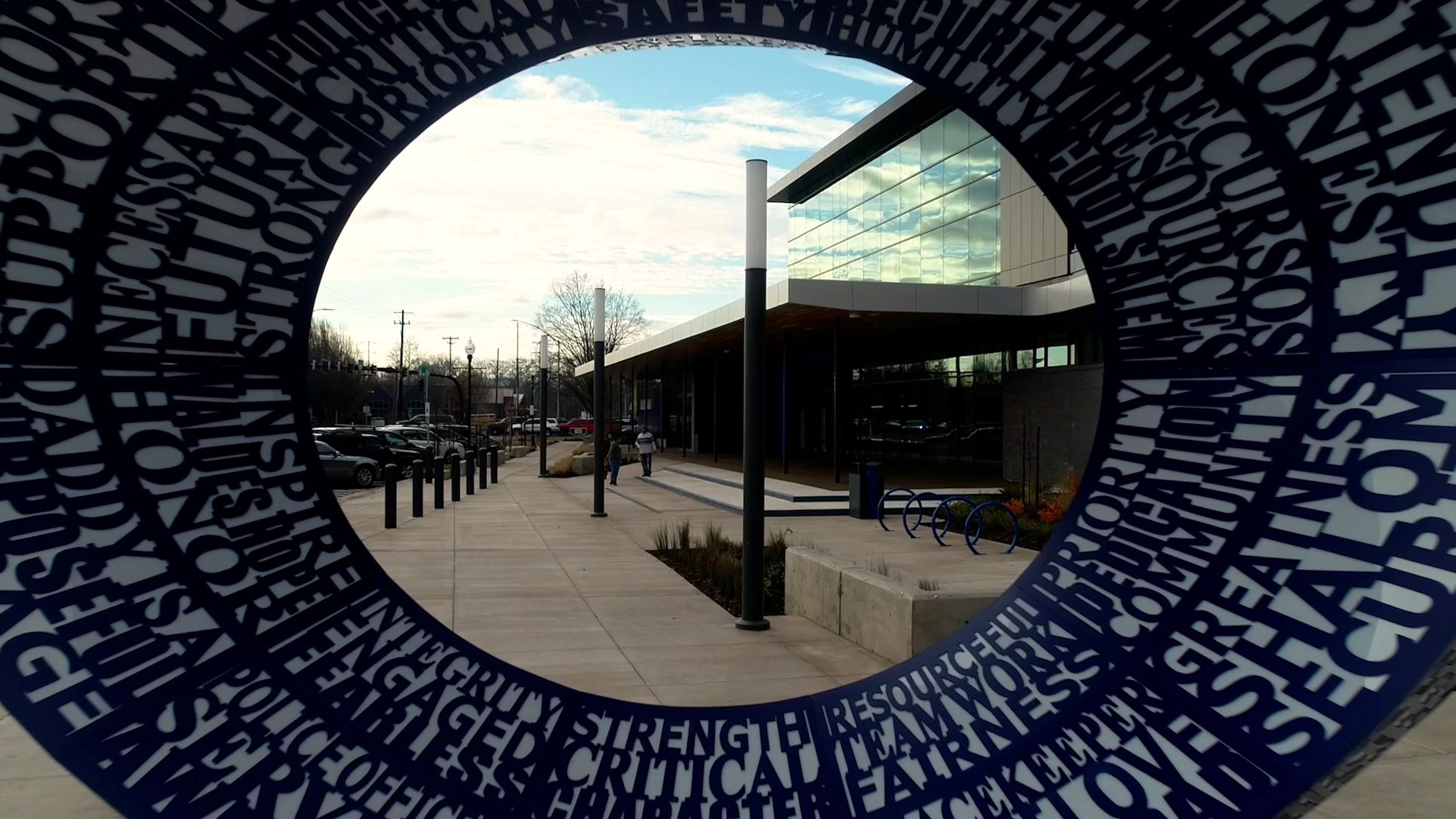 Looking through a donut shaped art sculpture outside a police station in Salem, Oregon