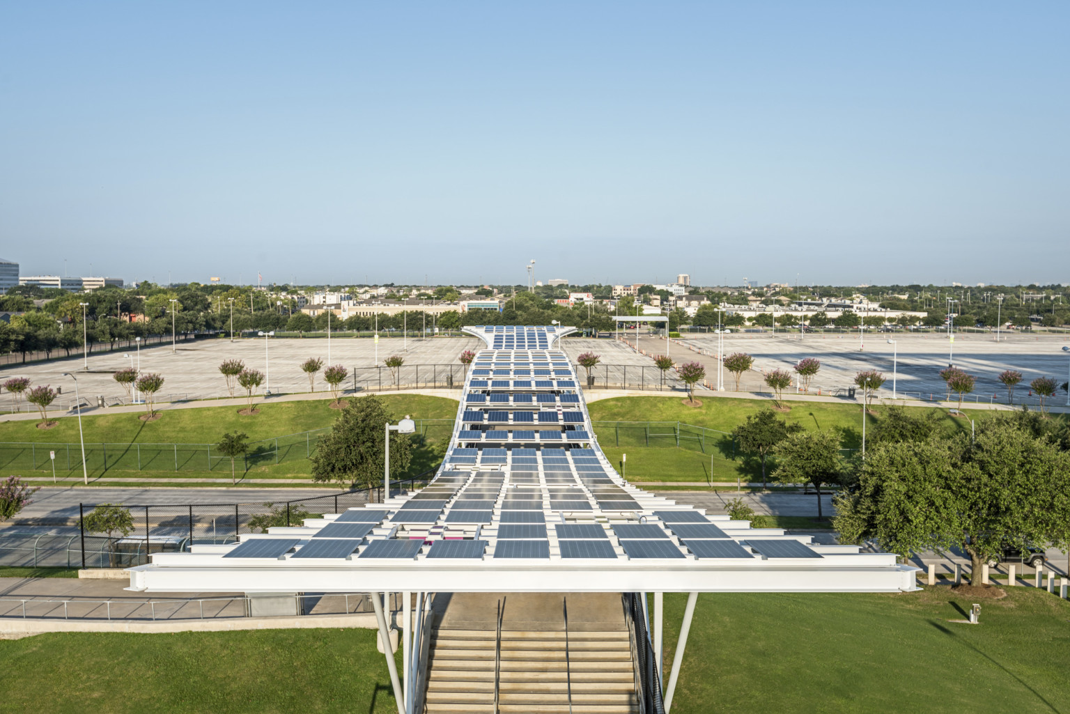 NRG Stadium, home of the Houston Texans, solar panel covered pedestrian bridge connecting stadium to parking lot across road