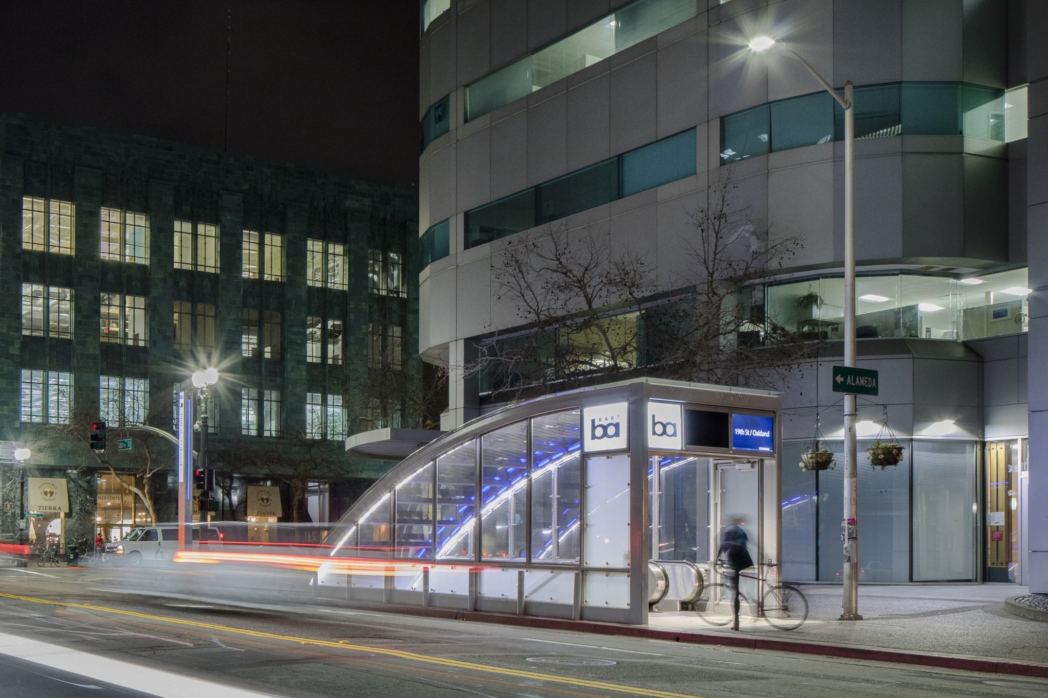 Bay Area Rapid Transit station street level entrance at 19th Street and Oakland. A blue and glass shelter leading underground Bay Area Rapid Transit station street level entrance at 19th Street and Oakland. A blue and glass shelter leading underground