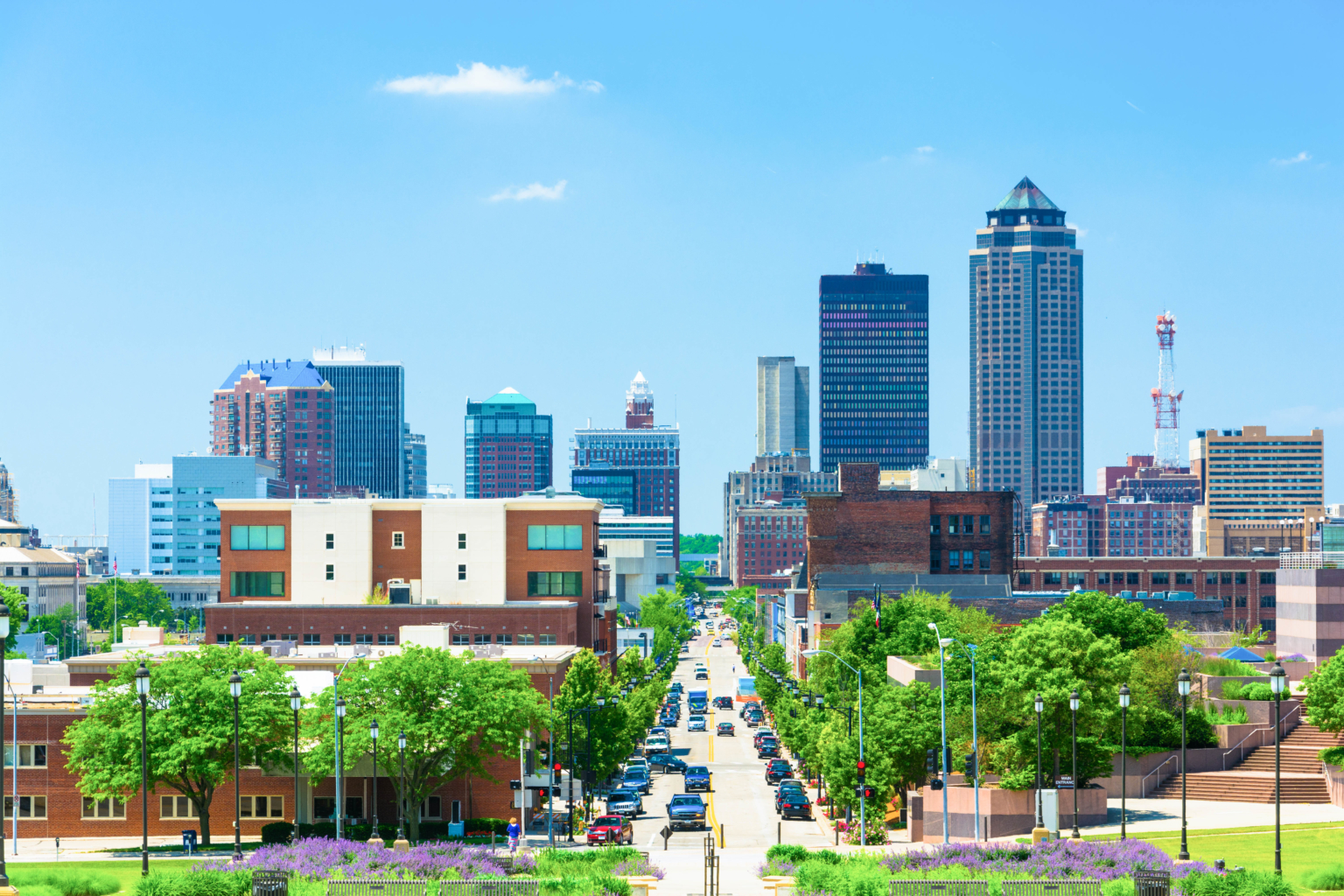 downtown des moines skyline with trees flanking a main street