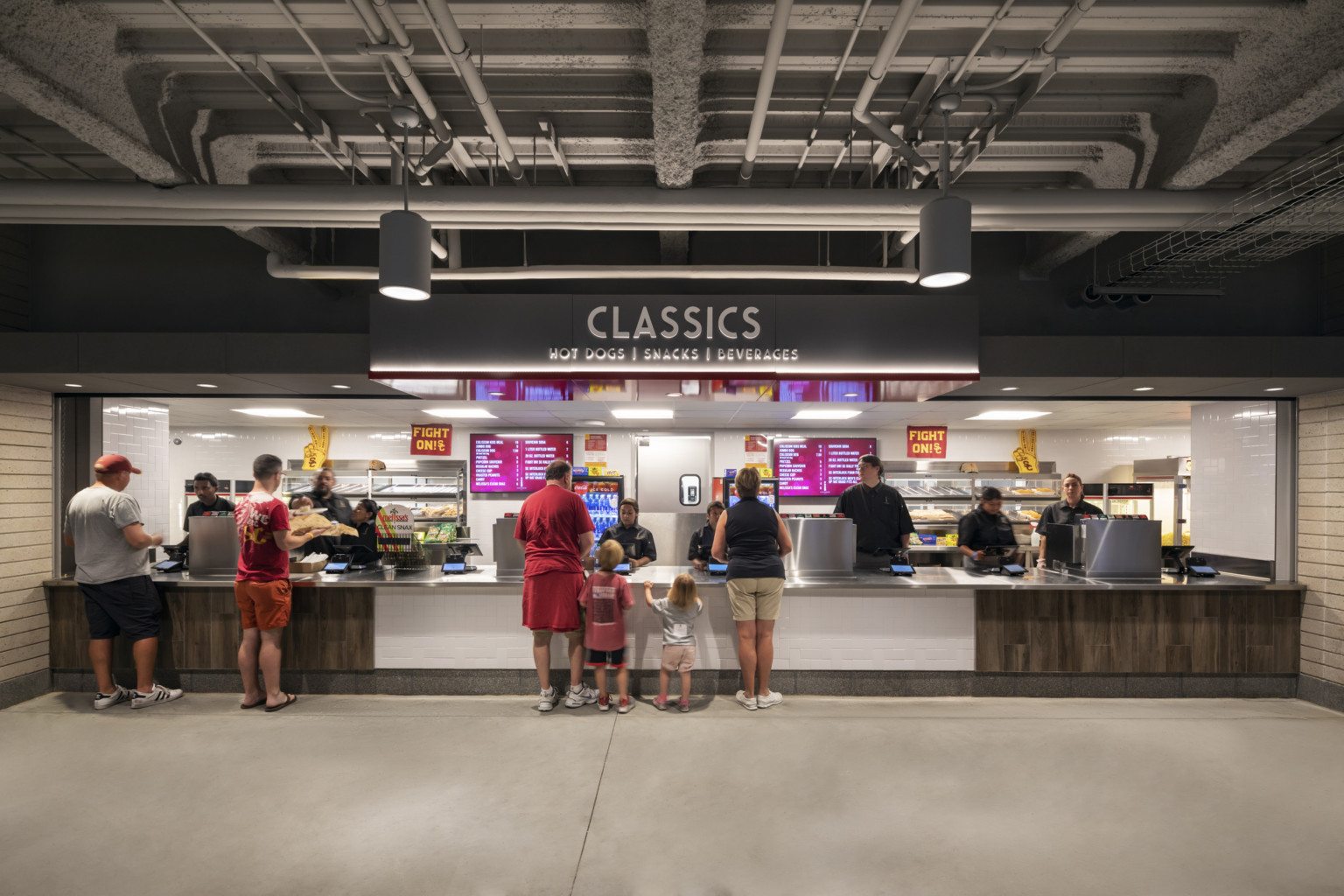 Concessions stand labeled Classics: Hot Dogs, Snacks, Beverages. Stainless steel counter on white and wood base
