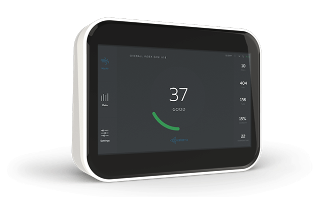 Close up view of a white Indoor Air Quality monitor with a healthy reading. Viewing option buttons on either side of screen Close up view of a white Indoor Air Quality monitor with a healthy reading. Viewing option buttons on either side of screen