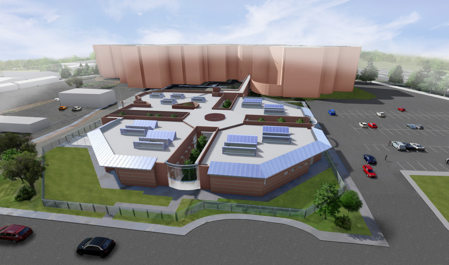 Aerial view from front of rendering of octagonal shaped single story building with silver awnings and rooftop solar arrays Aerial view from front of rendering of octagonal shaped single story building with silver awnings and rooftop solar arrays