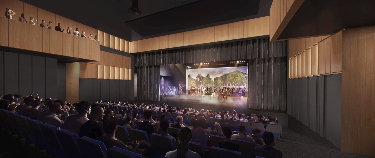 Rendering of theater with black walls with wood sections at top and balcony, facing a illuminated stage