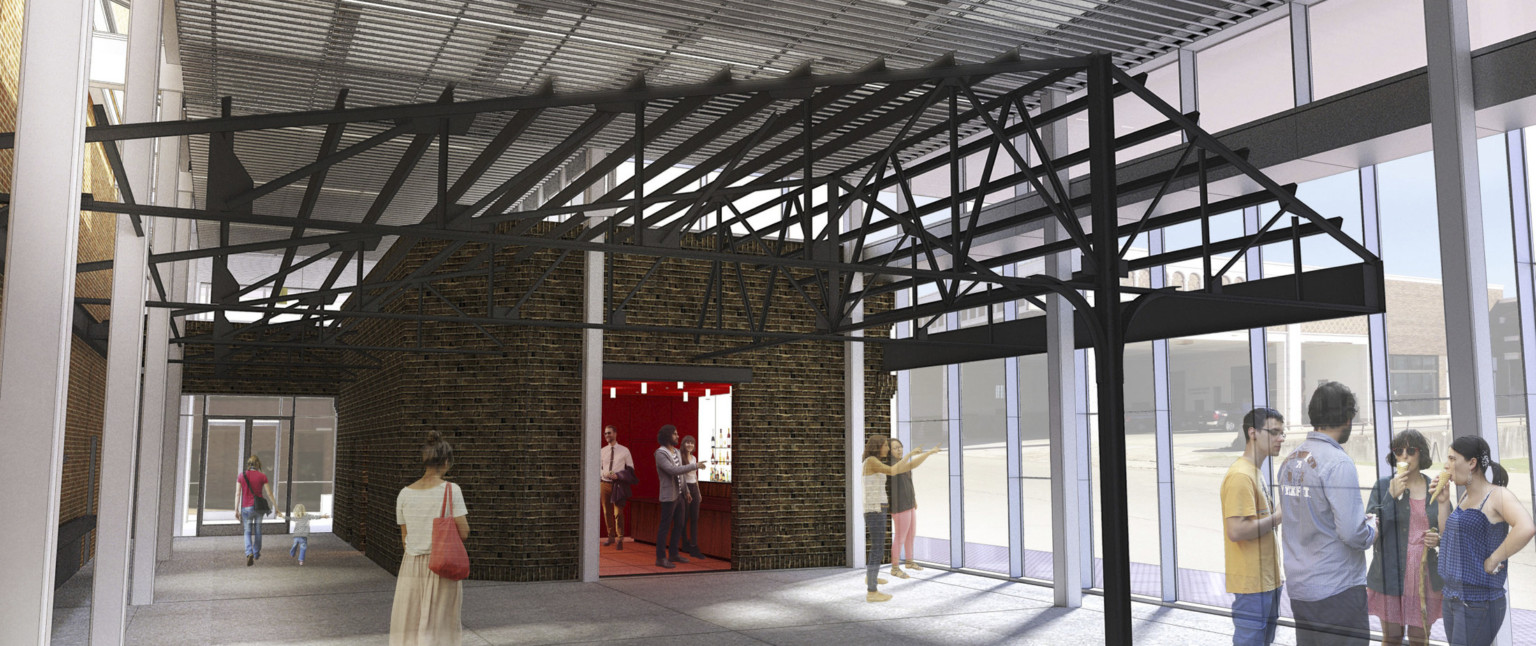 Exposed brick room surrounded by black metal trusses within a larger white art gallery with double height window right wall