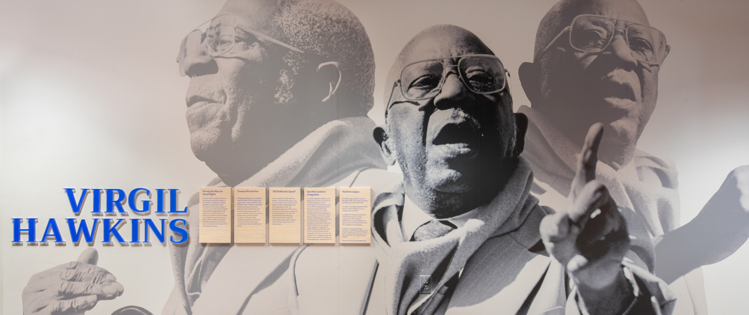 Photo mural of Virgil Hawkins with name written in blue with 5 panels of information