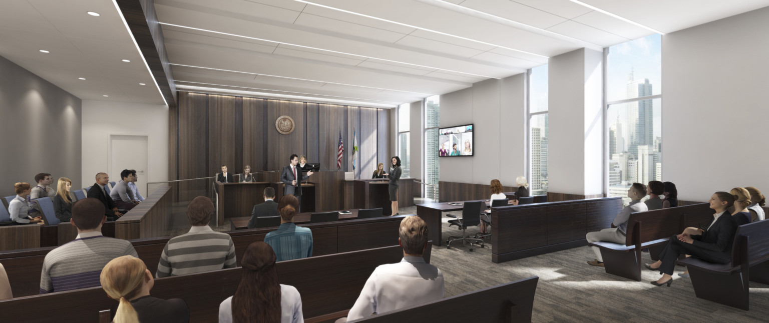 Another white courtroom with dark wood accents. The jury box is on the left wall, facing windows at right