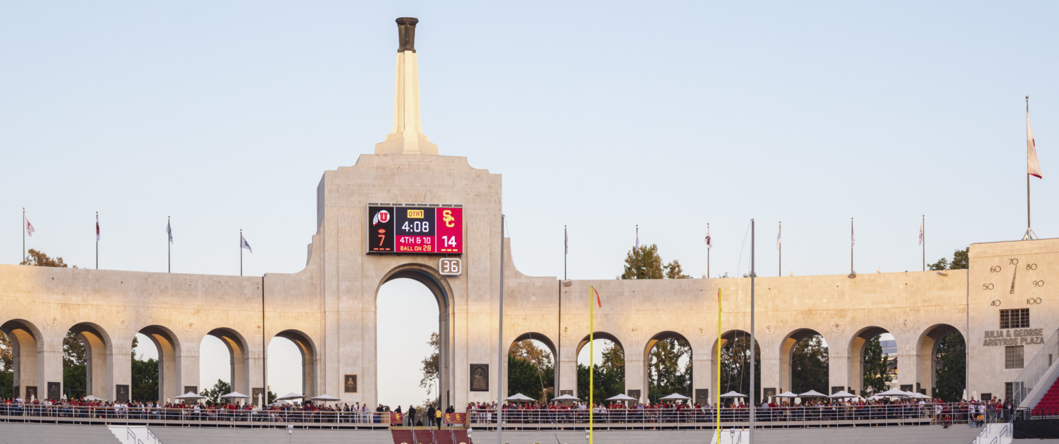 Entry concourse of Los Angeles Memorial Coliseum with central tower and Olympic Cauldron on top of a spire