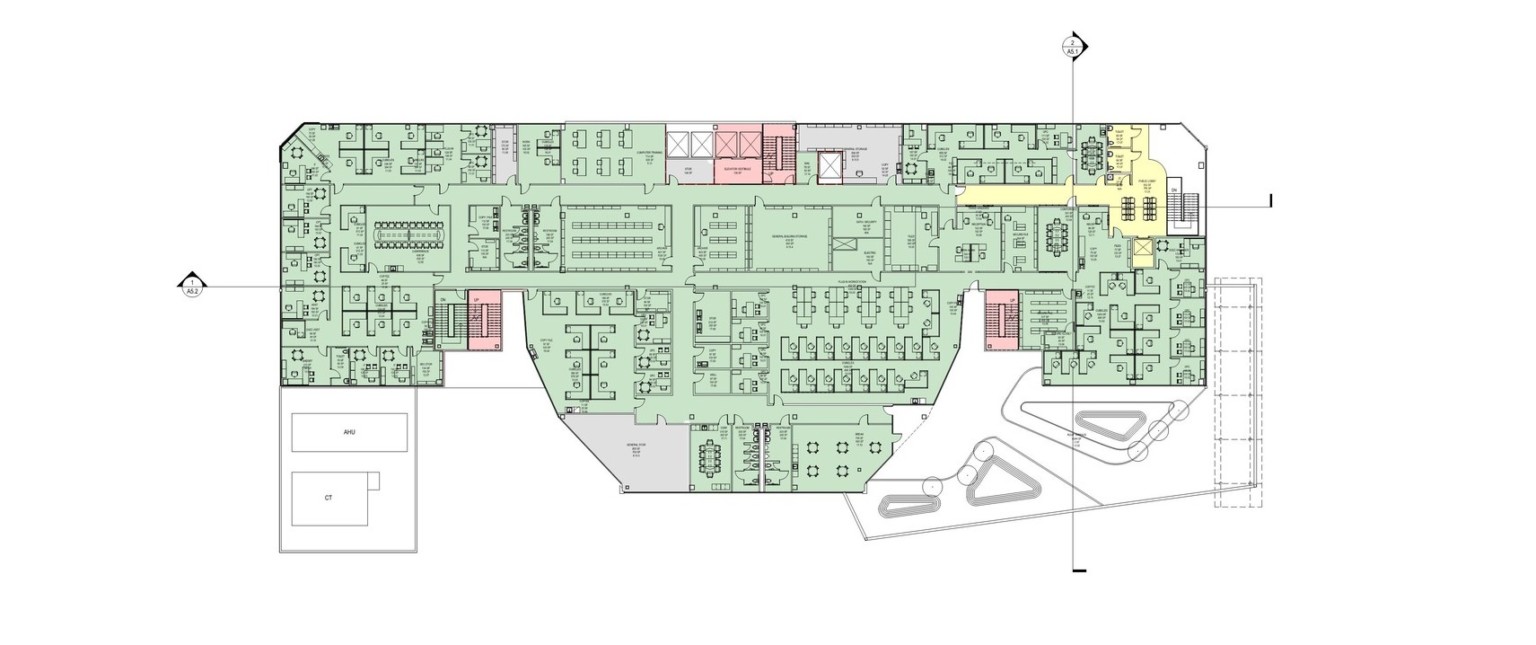 A color coded floor plan of a level of the building. Most of the building is green with a few scattered red, grey and yellow