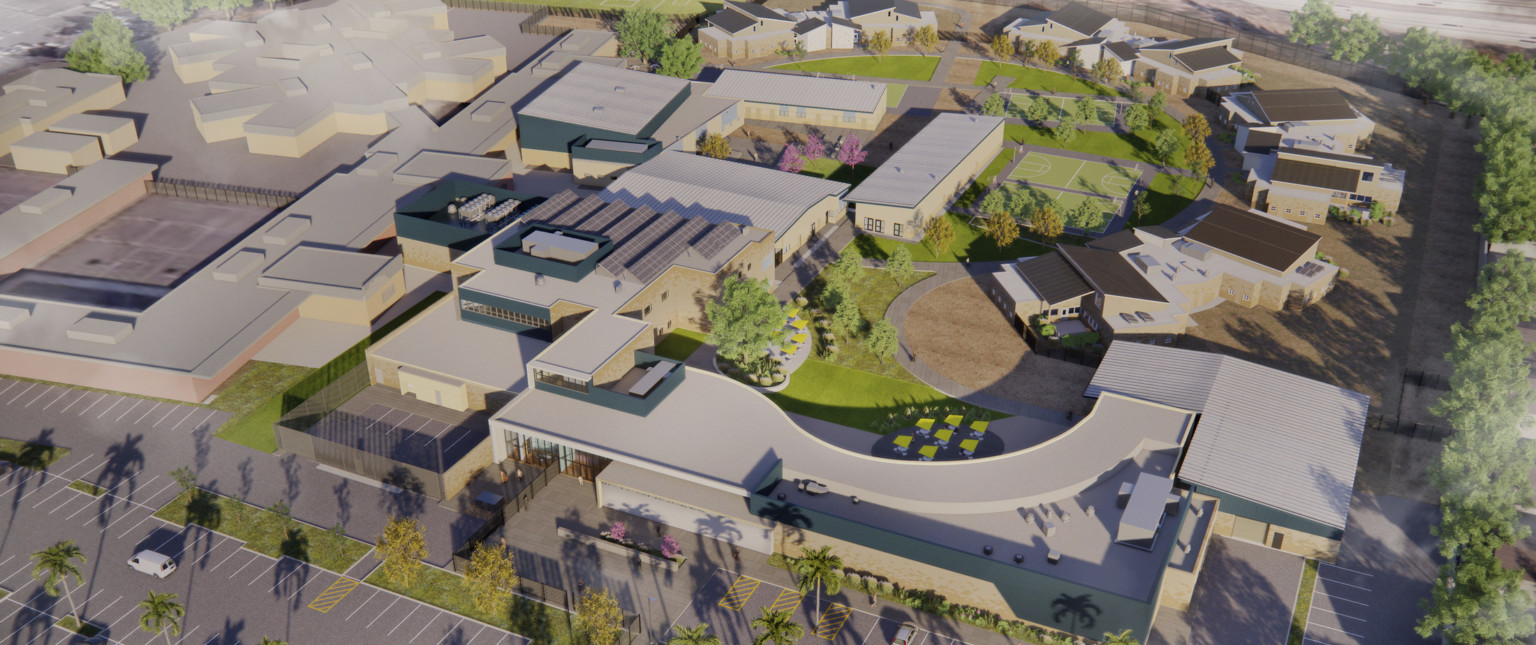 Aerial rendering of campus from front entrance. Main building curves around courtyard with greenery and additional buildings