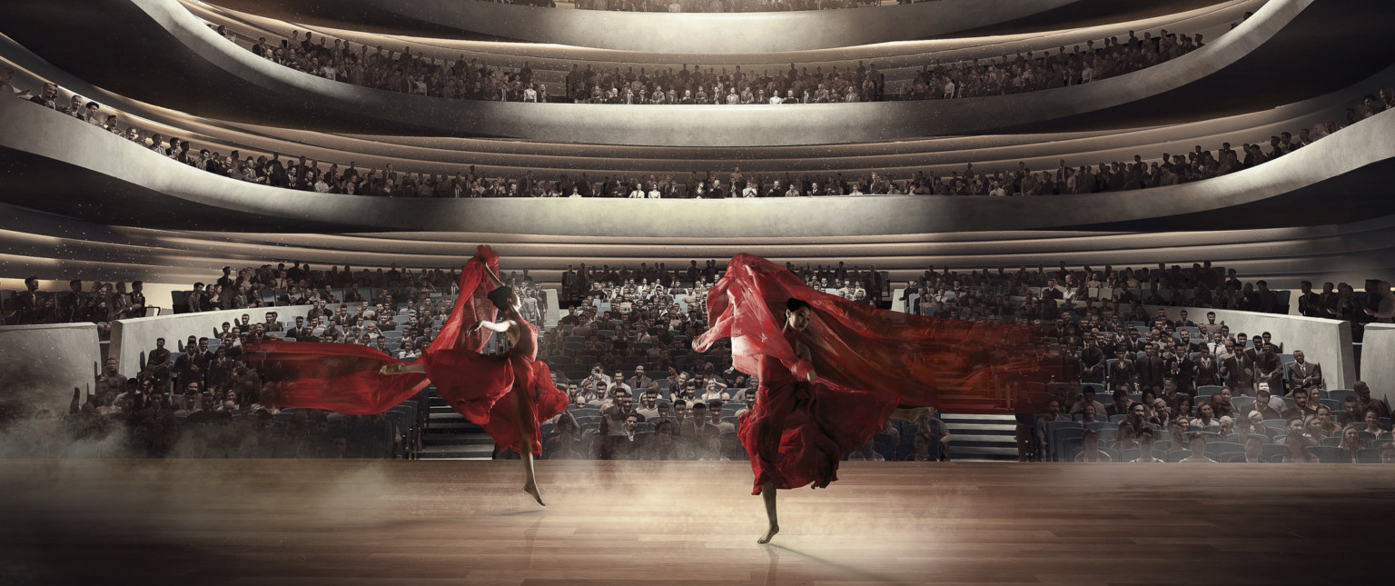 Upstage view of two dancers with red cloth lit from above center in front of audience at ground level and two balconies