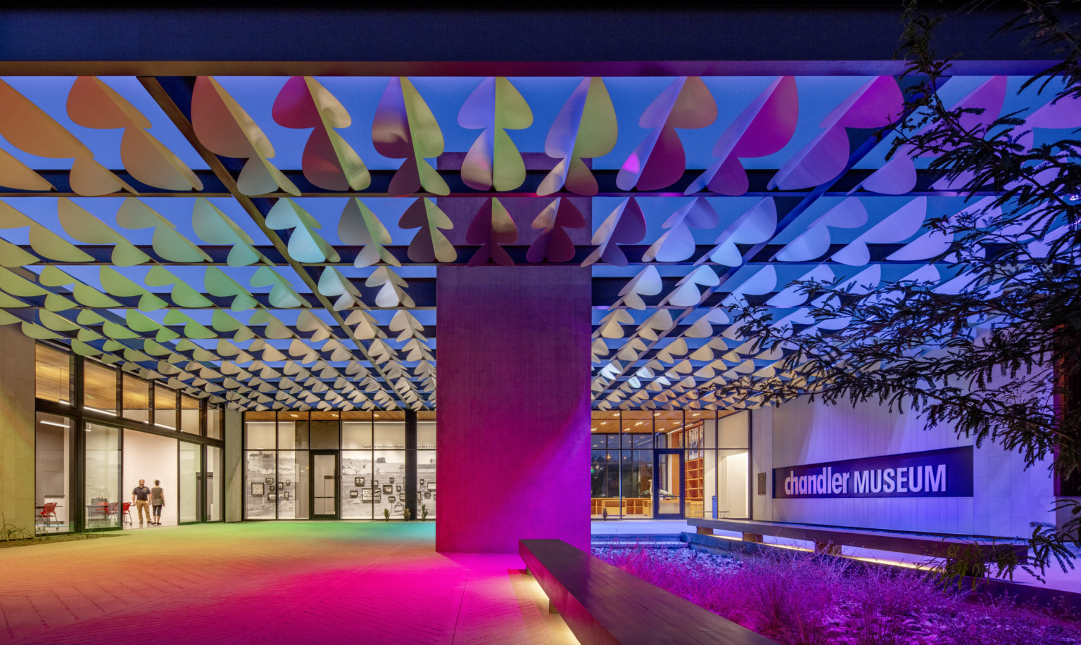 Infinite Wave shade at the Chandler Art Museum illuminated in multicolor array at night