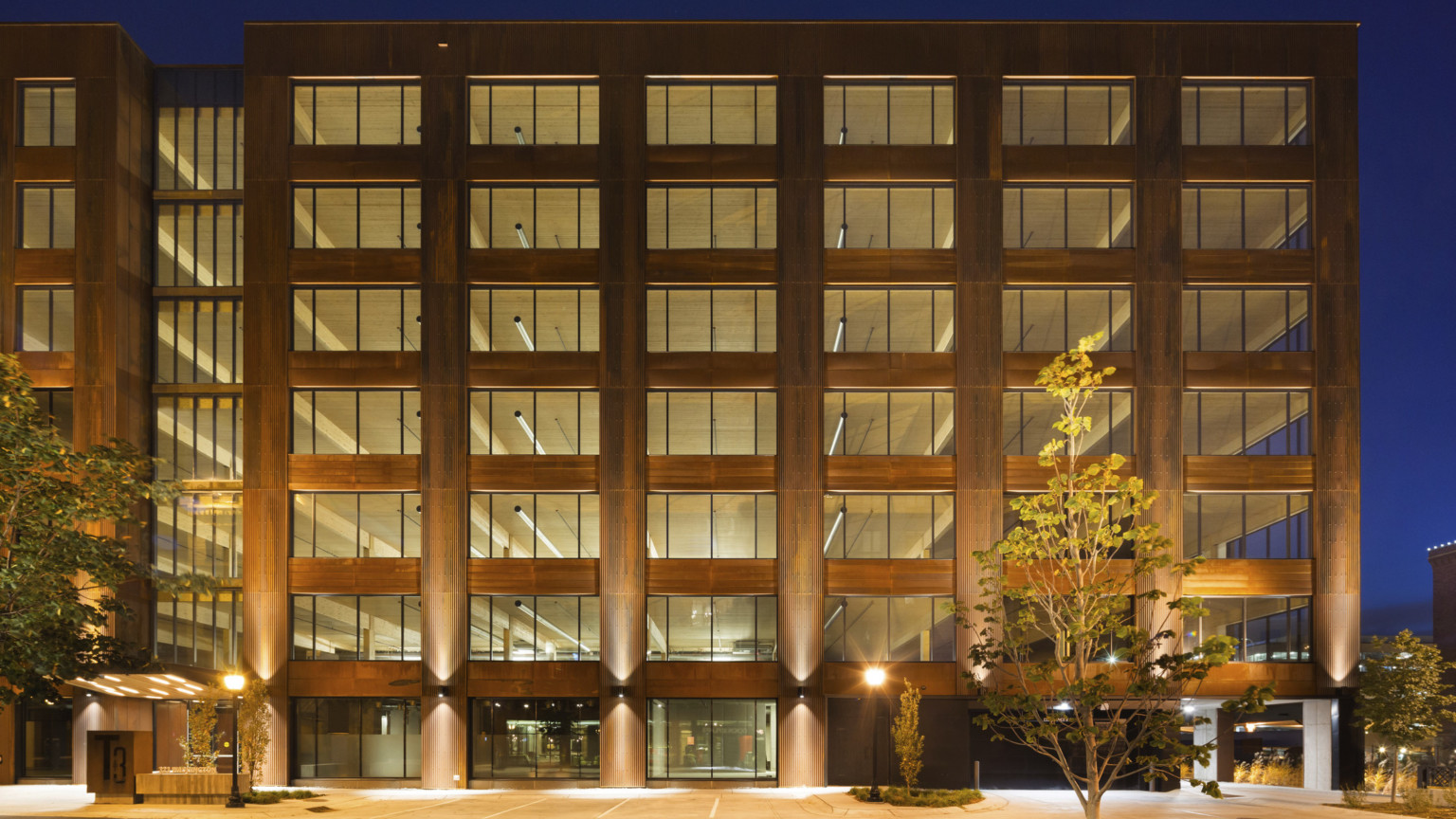 Hines T3 Partnership building in Minneapolis, a mass timber midrise building illuminated at night