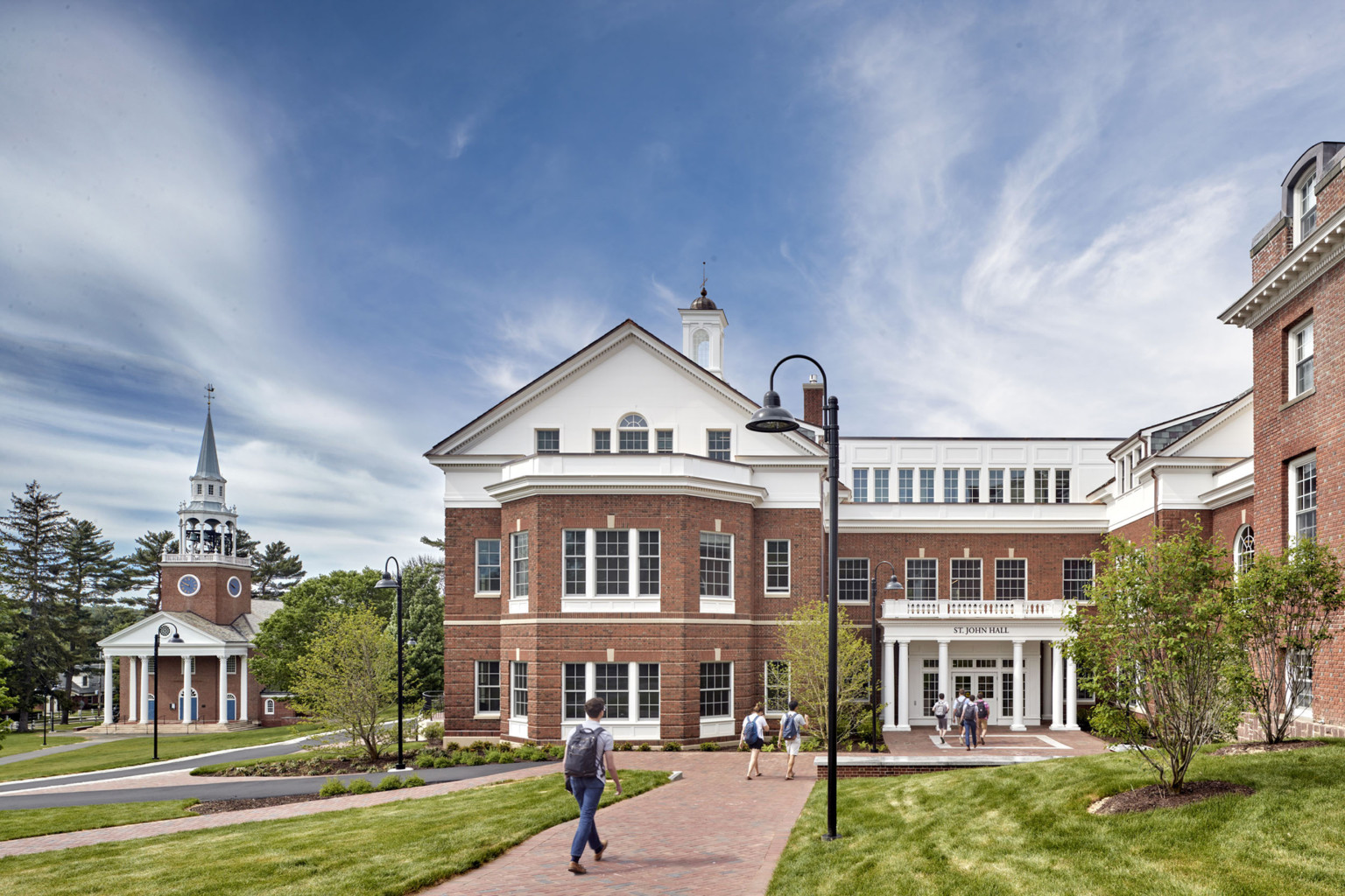 Choate Rosemary Hall, a neo-colonial red brick three-story building with entryway facing green lawn. Sign reads St. John Hall Choate Rosemary Hall, a neo-colonial red brick three-story building with entryway facing green lawn. Sign reads St. John Hall