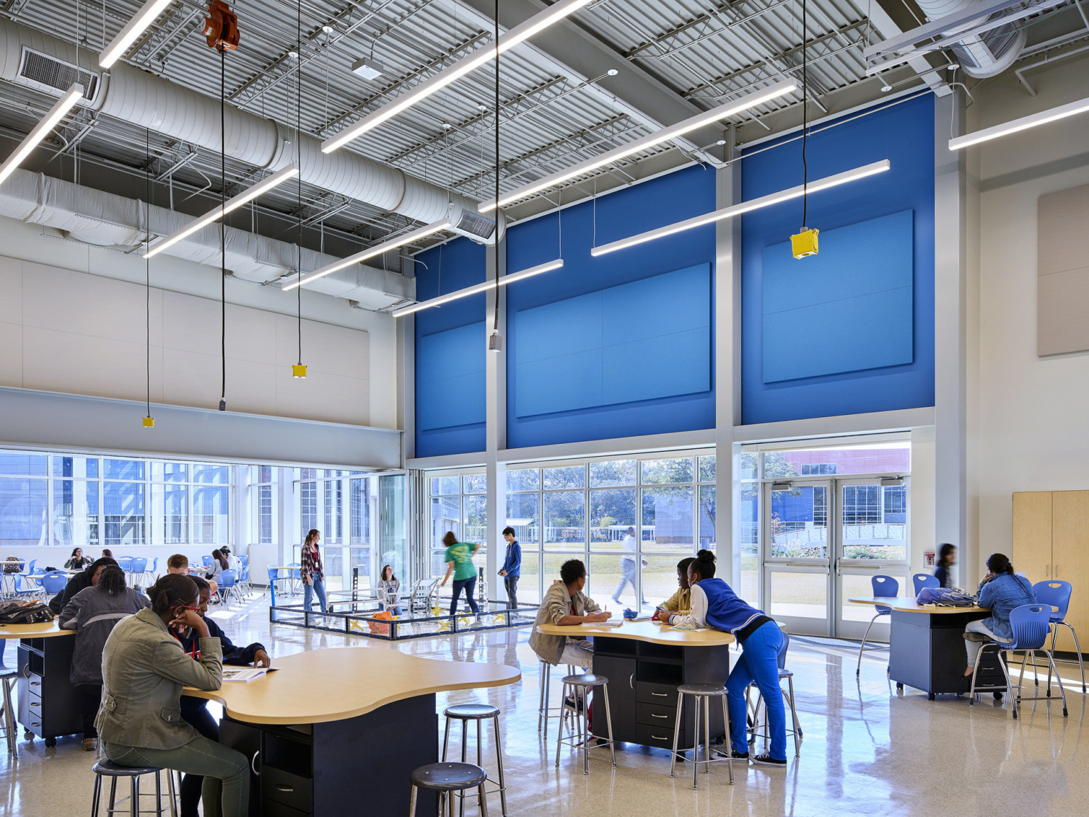 Large double height learning space in East Baton Rouge Liberty High School with drop power and a robotics ring for students