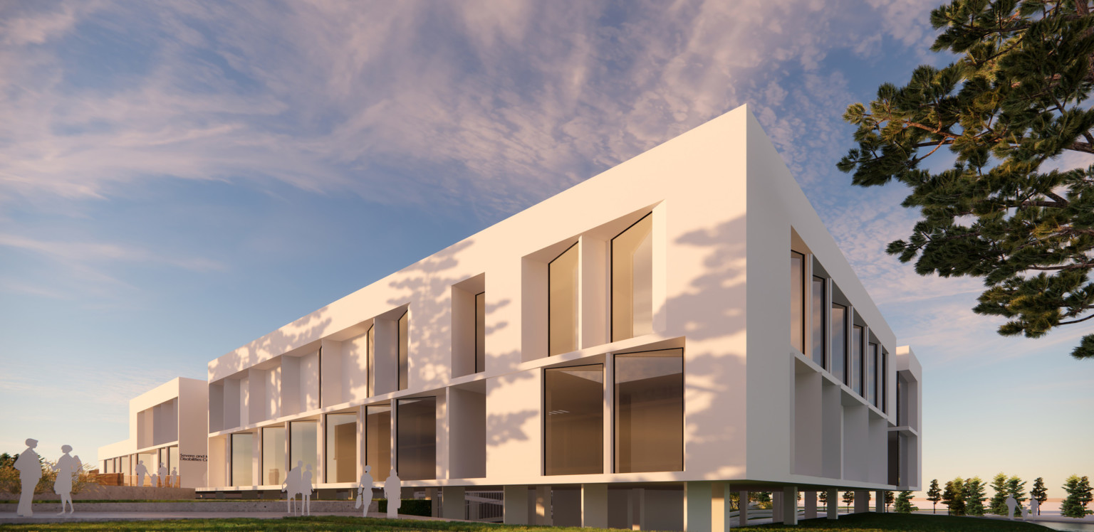 2 story white building raised above grade with recessed serrated windows surrounded by grass and trees 2 story white building raised above grade with recessed serrated windows surrounded by grass and trees