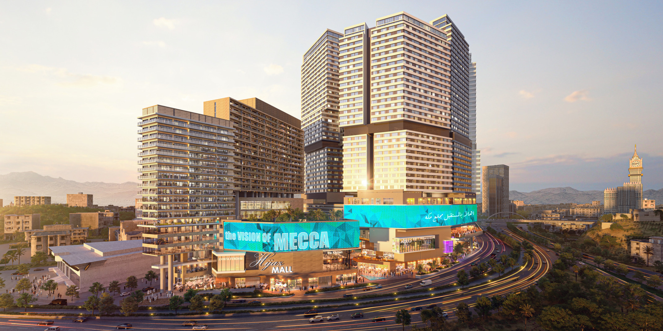 Al Hijaz, a midrise shopping center with lighted display along top with garden on left roof and tall buildings behind