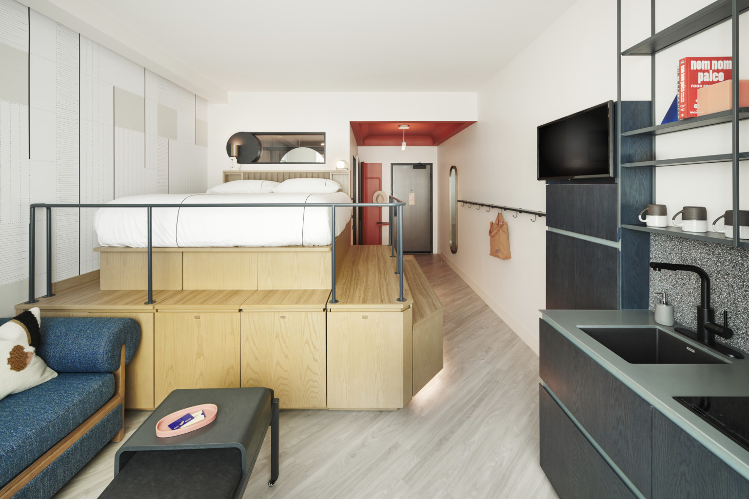 hotel room with custom bed design hiding a desk and wardrobe hotel room with custom bed design hiding a desk and wardrobe