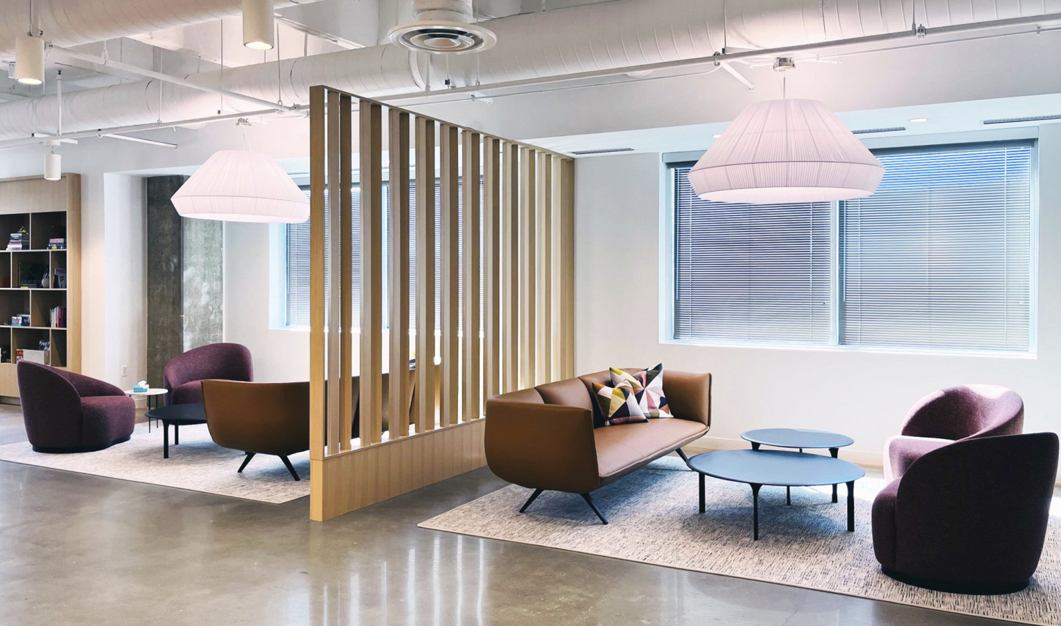 polished concrete floors, painted white exposed ceiling with seating clusters separated by free standing wood panel dividers polished concrete floors, painted white exposed ceiling with seating clusters separated by free standing wood panel dividers